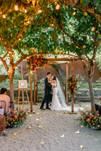 First kiss during a fall wedding ceremony at Barndiva in Healdsburg, California